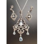 SUITE OF AQUAMARINE AND MARCASITE JEWELLERY comprising a pendant and matching earrings, all in