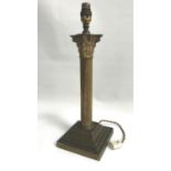 BRASS CORINTHIAN COLUMN TABLE LAMP raised on stepped base, 43cm high