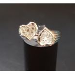 UNUSUAL DIAMOND SET RING in unmarked white gold with pave set diamond heart shaped finials, ring