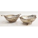 PAIR OF CONTINENTAL PIERCED SILVER BON-BON DISHES each dish with wavy beaded rim, two scroll handles