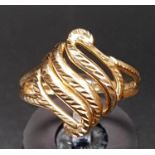 TEN CARAT GOLD RING of pierced scroll design, ring size N