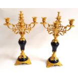 PAIR OF GILT METAL AND ENAMEL CANDELABRA each with four shaped arms with shaped drip pans and