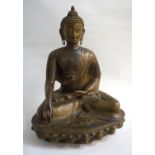 19TH CENTURY BRONZE BUDDHA SHAKYAMUNI seated with legs crossed with one hand across his lap with the