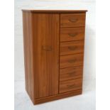 ALSTONES OAK COMPACTUM with a bow front moulded top above a narrow wardrobe door opening to reveal