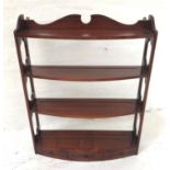 WADE MAHOGANY BOW FRONT WALL SHELVES with a shaped and carved top rail above pierced sides with four