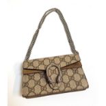 GUCCI DIONYSUS GG SUPER MINI BAG in Beige GG Supreme canvas with textured tiger head closure, with