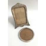 TWO GEORGE V SILVER PHOTOGRAPH FRAMES one of shaped design on easel support, Birmingham 1916, 19.8cm