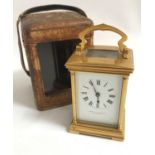 HAMILTON & INCHES EDINBURGH BRASS BOUND CARRIAGE CLOCK the white enamel dial with Roman numerals,