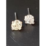 MATCHED PAIR OF DIAMOND STUD EARRINGS the diamonds totalling approximately 0.45cts, in nine carat