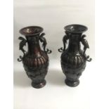 LARGE PAIR OF JAPANESE STYLE VASES in brass with relief decoration of cranes and bamboo, with
