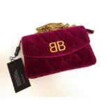 NEW AND UNUSED BALENCIAGA QUILTED VELVET HANDBAG in cerise colour, with removable chain link