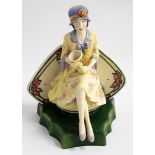 KEVIN FRANCIS LIMITED EDITION FIGURINE of Charlotte Rhead seated holding a vase, 21.5cm high, boxed