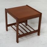 DANISH TEAK OCCASIONAL TABLE with a square top standing on shaped supports united by a slatted