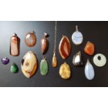 GOOD SELECTION OF AGATE AND HARDSTONE PENDANTS including one on fine nine carat gold chain,