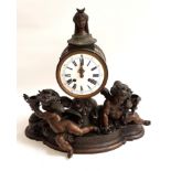 LARGE FRENCH BRONZE CHIMING MANTEL CLOCK with two cherubs modeled beneath the circular enamel dial