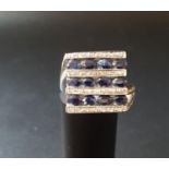 UNUSUAL ART DECO STYLE SAPPHIRE AND DIAMOND DRESS RING with alternating rows of oval cut sapphires