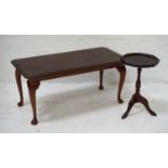 STAINED OCCASIONAL TABLE with an oblong moulded top, standing on cabriole supports, 101cm wide;