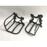 PAIR OF VINTAGE METAL JOCKEY SADDLE RACKS for wall mounting with bridle hooks, each marked '