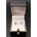 PAIR OF DIAMOND SET HEART SHAPED STUD EARRINGS in fourteen carat white gold, the diamonds