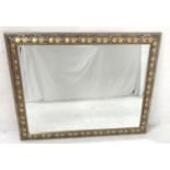 LARGE OBLONG WALL MIRROR with a carved frame decorated with leaves around a bevelled plate, 110cm