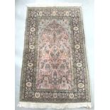 PERSIAN STYLE PRAYER RUG with a pale blue and pink ground encased by a floral border, fringed, 154cm