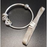 PANDORA MOMENTS SILVER BANGLE with two charms and a clip; together with a Pandora silver