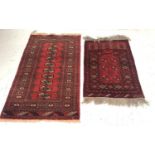 TWO FLOOR RUGS comprising an Ishfan rug with a red ground and multi lozenge sectional decoration