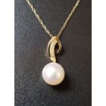 PEARL AND DIAMOND PENDANT in nine carat gold and on nine carat gold chain