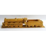 MATCHSTICK MODEL OF A STEAM ENGINE LOCOMOTIVE AND TENDER on a section of matchstick track, 58.5cm