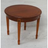 CIRCULAR CHERRY OCCASIONAL TABLE with a plain frieze standing on tapering supports with spade