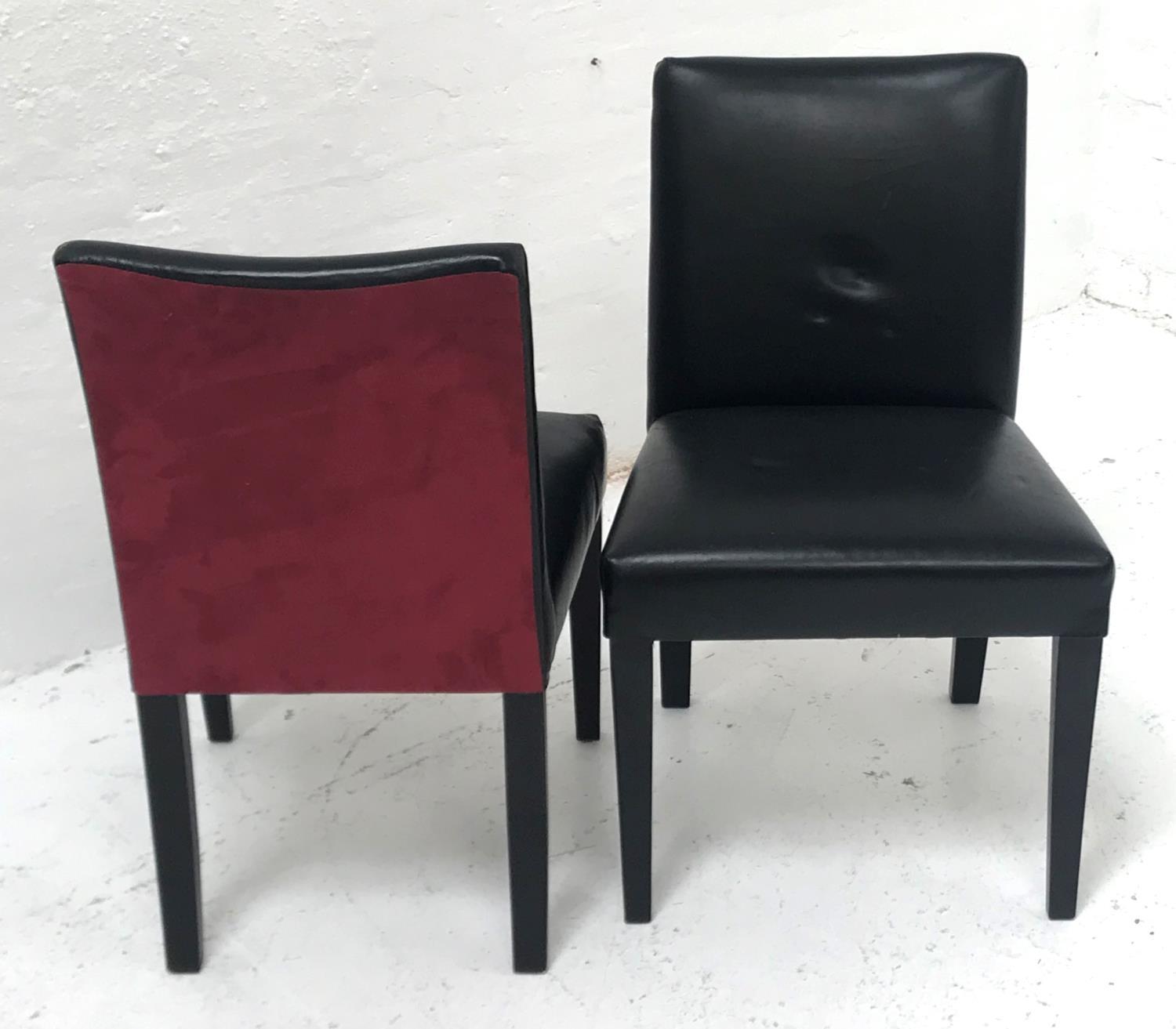 SET OF SIX DINING CHAIRS covered in black faux leather with faux raspberry suede backs, standing