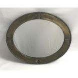 EARLY 20TH CENTURY ARTS & CRAFTS DESIGN BRASS FRAMED OVAL WALL MIRROR with bound reeded edge and