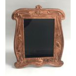 ART NOUVEAU STYLE COPPER PHOTOGRAPH FRAME the shaped frame with relief bird and scroll decoration,