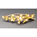 SEED PEARL FLORAL SPRAY BROOCH in unmarked high carat gold, approximately 3.9cm long