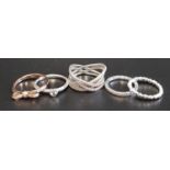 FIVE PANDORA RINGS comprising four silver examples - Cosmic Lines, Delicate Heart, Hearts of