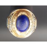 TEN CARAT GOLD JOSTEN AMERICAN COLLEGE RING the central oval blue cabochon stone flanked by J, 1 and