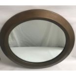 MODERN CIRCULAR WALL MIRROR with a copper effect frame and circular plate, 86cm diameter