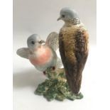 BESWICK FIGURE OF A PAIR OF TURTLE DOVES on naturalistic base, impressed number 1022, 19cm high