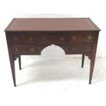 MAHOGANY KNEEHOLE DESK with an inset leather top above an arrangement of five drawers with
