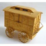 MATCHSTICK MODEL OF A HORSE DRAWN TRAVELLER'S CARAVAN with movable window shutters and door, a set