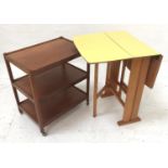 1960'S YELLOW MELAMINE GATELEG TABLE with drop flaps, standing on plain supports united by a