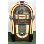 1940'S STYLE BABY JUKEBOX in a shaped case with compact disc operation and an FM/AM radio, 100cm