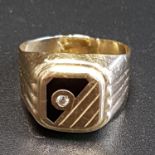 FOURTEEN CARAT GOLD SIGNET RING decorated with CZ and black enamel, ring size R-S and