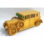 MATCHBOX MODEL OF A SEDAN MOTOR CAR with perspex windows and two spare tyres, 36cm long