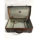 VINTAGE LEATHER SUITCASE with reinforced corners and with monogram A.B.S., the interior with luggage