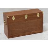 LIGHT OAK COLLECTORS CABINET with a rectangular lift up lid with reinforced brass corners opening to