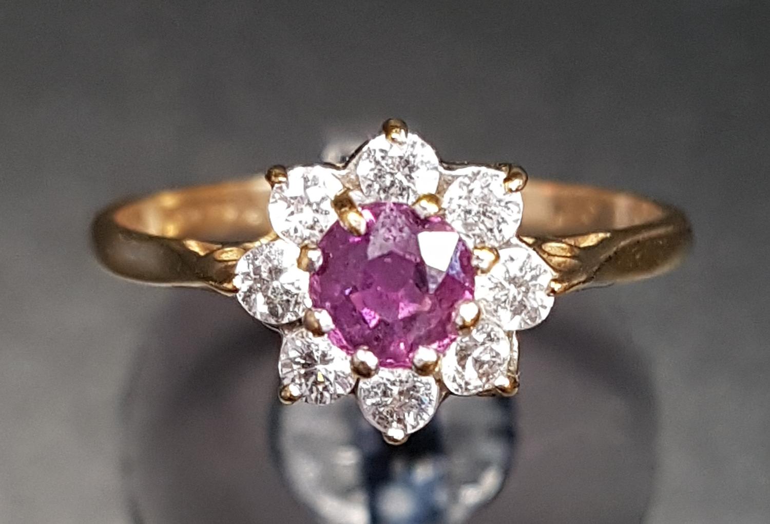 RUBY AND CZ CLUSTER RING on nine carat gold shank, ring size M-N