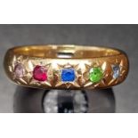 MULTI GEM SET GYPSY STYLE RING with flush set aquamarine, peridot, sapphire, ruby and pink topaz, on