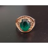 NINE CARAT GOLD DRESS RING with faceted green glass set in the pierced basket design setting, ring