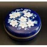 JAPANESE ANDO CLOISONNE CIRCULAR TRINKET BOX with a dark blue ground, the lid decorated with